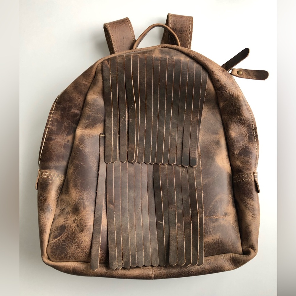 BRAND NEW! 100% real leather backpack with tassels.